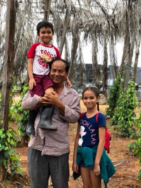 Cambodian pepper farmer and his children.